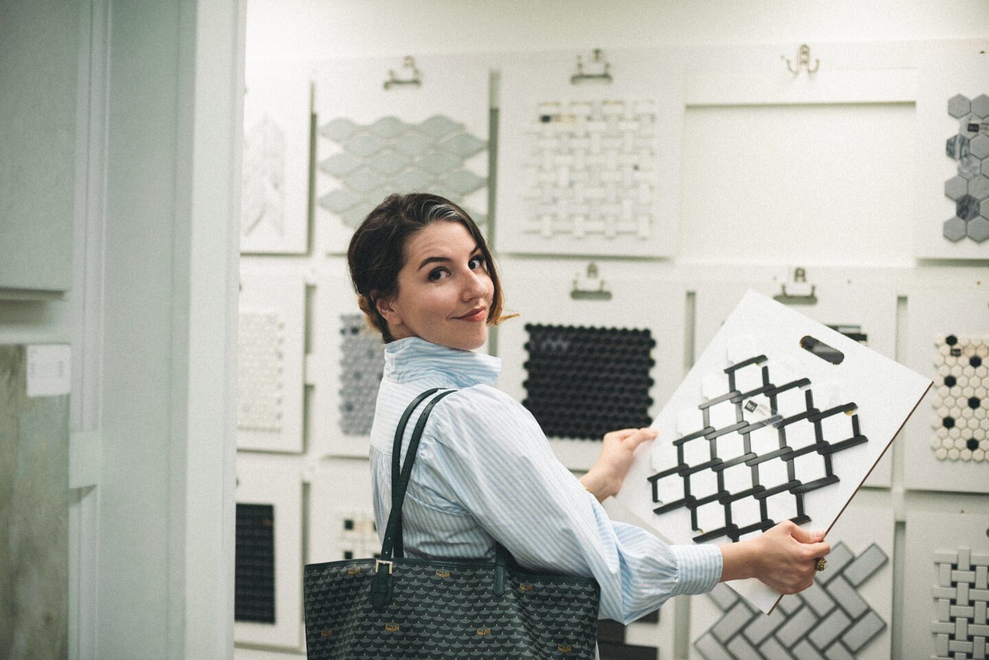 interior designer holding tile samples