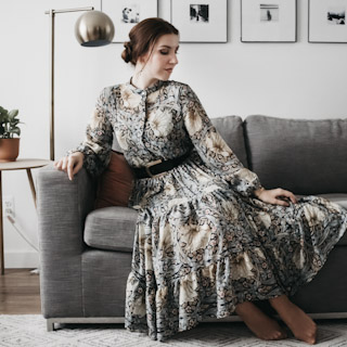 Woman sitting on modern sofa